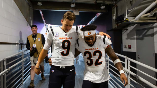 Oct 8, 2023; Glendale, Arizona, USA; Cincinnati Bengals quarterback Joe Burrow (9) celebrates with running back Trayveon Williams (32) following the game against the Arizona Cardinals at State Farm Stadium. Mandatory Credit: Mark J. Rebilas-USA TODAY Sports